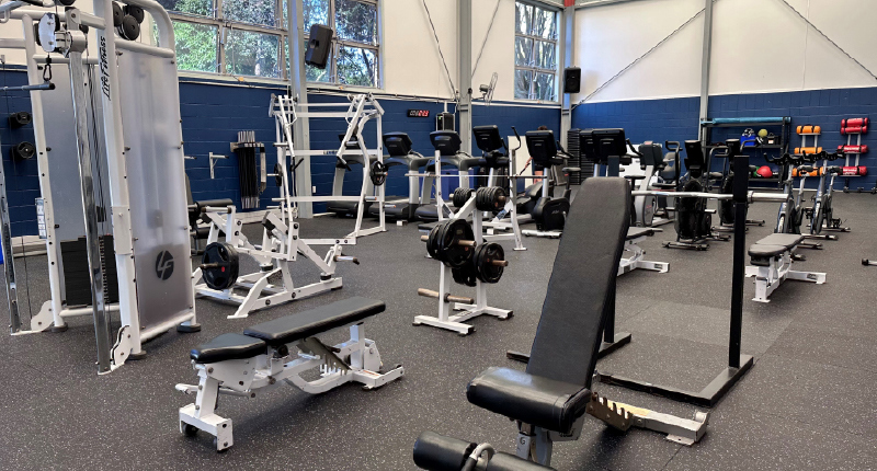 Birkenhead gym floor with exercise equipment including weights and cardio machines