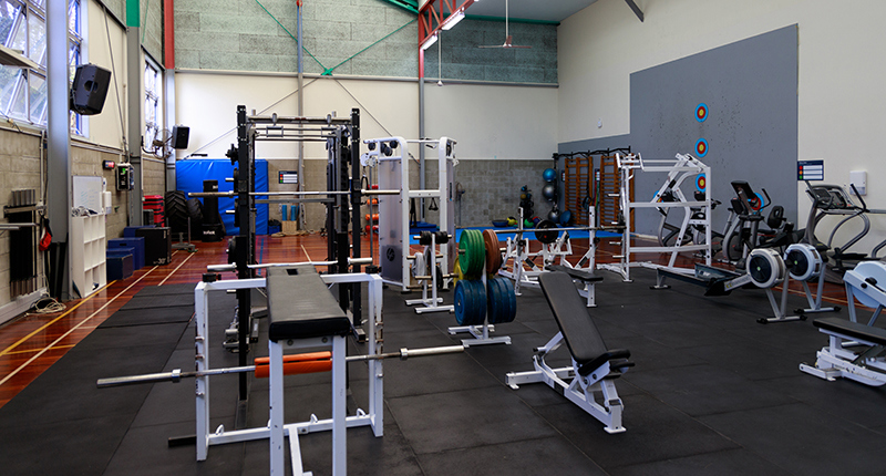 Birkenhead gym floor with exercise equipment including weights and rowers