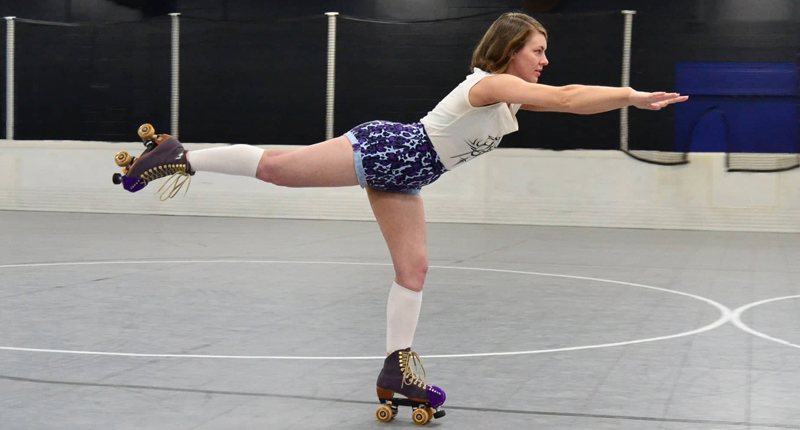 Danielle Gardner rollerblading indoors